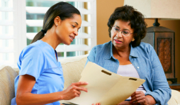senior woman and caregiver talking