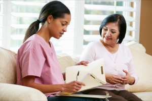 caregiver checking senior woman's condition