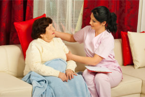 caregiver checking elderly woman's health